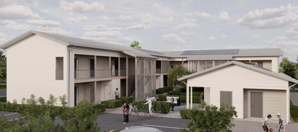 Valkoinen kaksikerroksinen rakennuskokonaisuus.