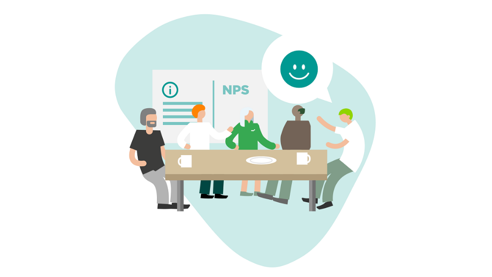 Työntekijät istuvat yhteisen pöydän ääressä. Taustalla lukee NPS.